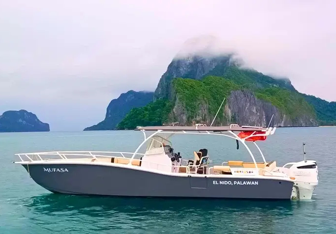 "Mufasa" boat in El Nido, Palawan, with scenic islands in the background.